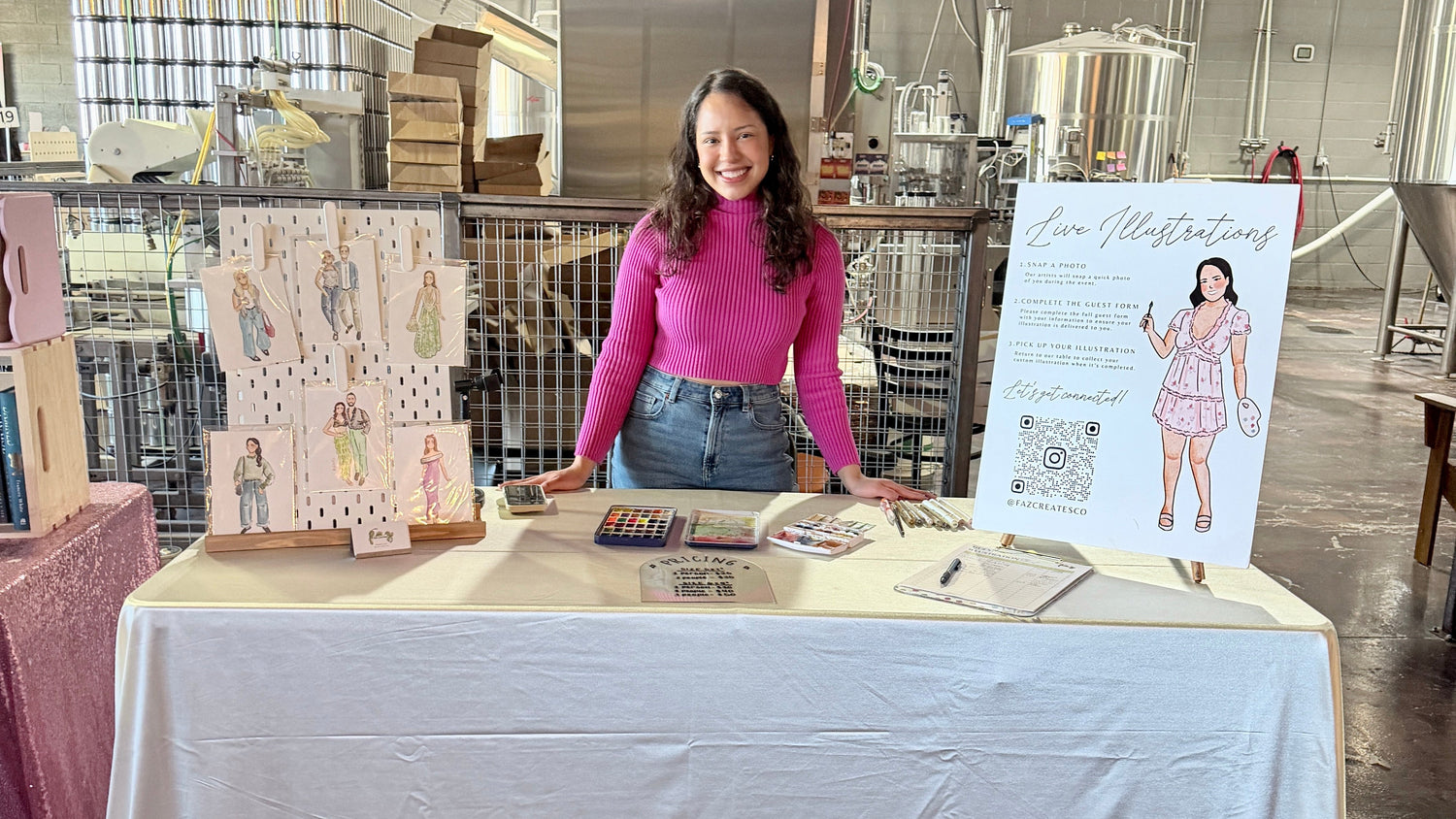 Woman standing behind a table with promotional materials in an indoor setting