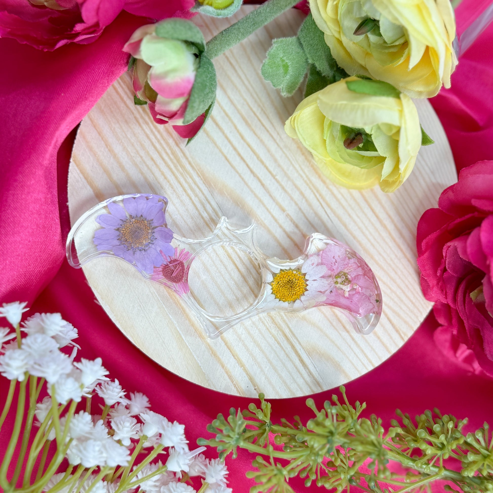 Resin page holder featuring real preserved flowers, handmade in Utah.