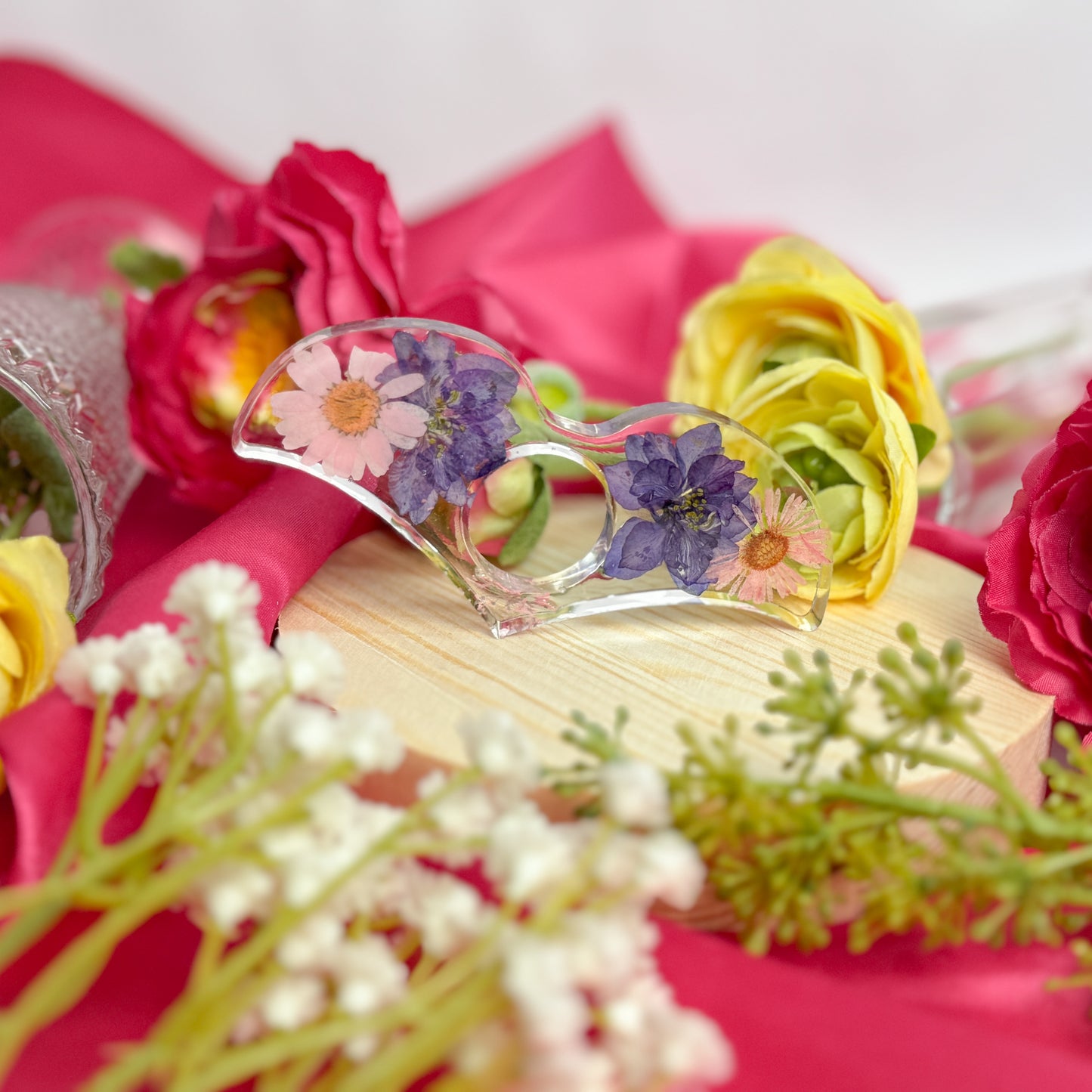 Resin page holder featuring real preserved flowers, handmade in Utah.